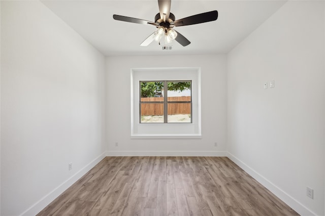 spare room with ceiling fan and light hardwood / wood-style floors