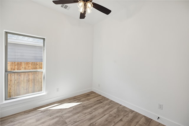 empty room featuring light hardwood / wood-style flooring and ceiling fan