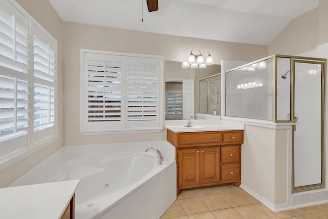 bathroom featuring tile patterned flooring, independent shower and bath, ceiling fan, and vanity