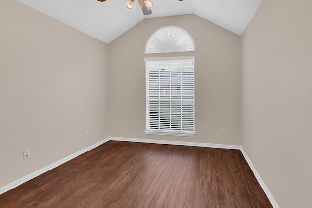 empty room with dark wood-type flooring, ceiling fan, and vaulted ceiling