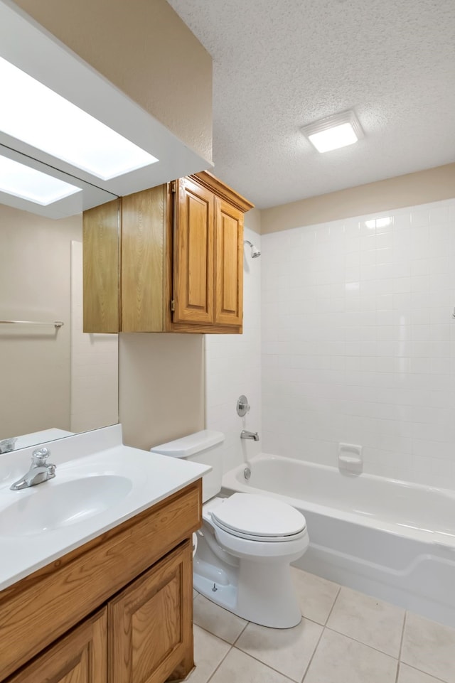 full bathroom with a textured ceiling, vanity, shower / washtub combination, toilet, and tile patterned floors