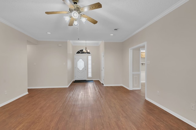 foyer featuring crown molding, wood-type flooring, and ceiling fan