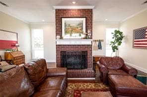 living room featuring crown molding and a fireplace