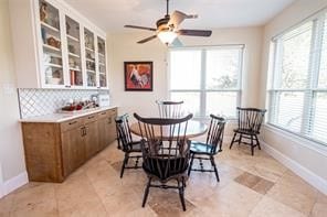 dining space featuring ceiling fan and a healthy amount of sunlight