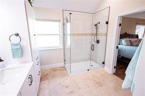 bathroom featuring ensuite bath, a shower stall, and vanity