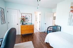 bedroom featuring wood finished floors and a closet