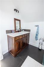 bathroom featuring vanity and vaulted ceiling