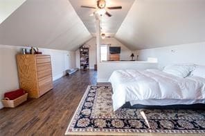 bedroom featuring ceiling fan, dark hardwood / wood-style floors, and vaulted ceiling