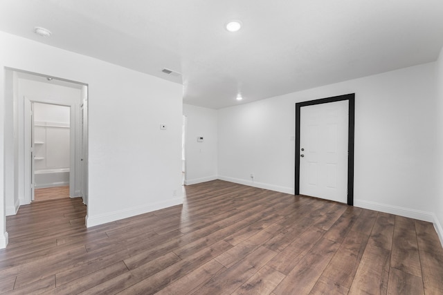 kitchen with dark hardwood / wood-style flooring, sink, and tasteful backsplash