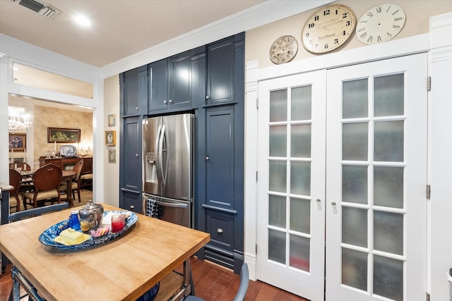 kitchen with dark hardwood / wood-style floors, stainless steel fridge, blue cabinets, and french doors