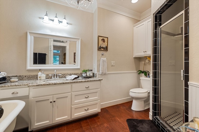 full bathroom with separate shower and tub, hardwood / wood-style floors, toilet, vanity, and ornamental molding