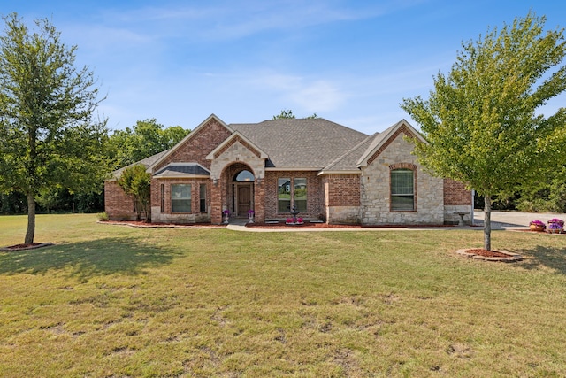 single story home with a front yard