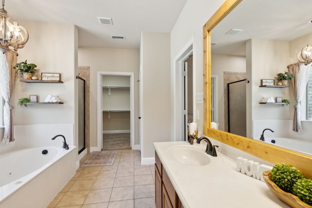 bathroom with vanity, independent shower and bath, and tile patterned floors