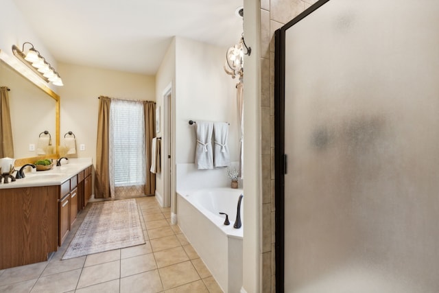 bathroom featuring vanity, separate shower and tub, and tile patterned floors