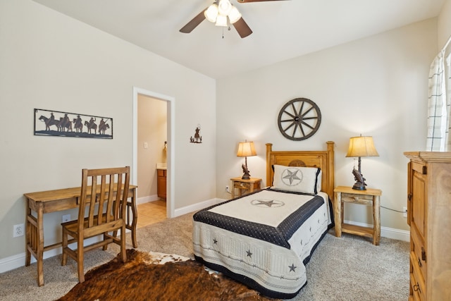 bedroom with carpet, ceiling fan, and ensuite bathroom