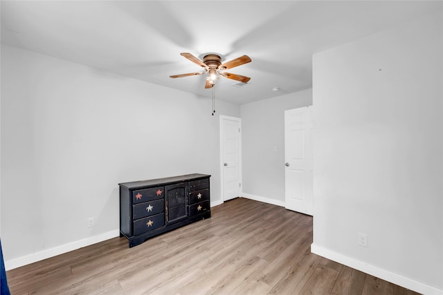 unfurnished room with light hardwood / wood-style flooring and ceiling fan