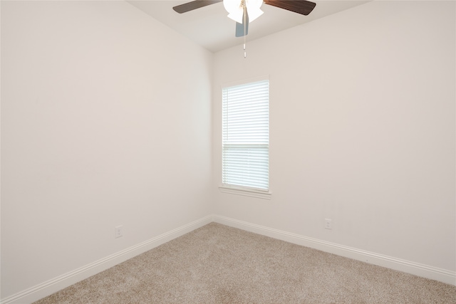 spare room featuring ceiling fan and carpet floors