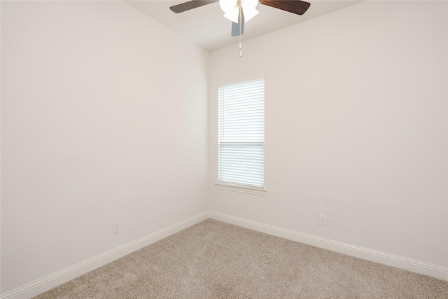 unfurnished room with carpet flooring, baseboards, and ceiling fan