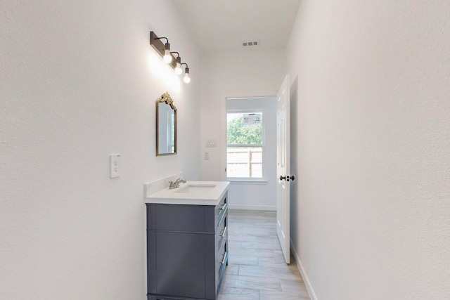 bathroom featuring hardwood / wood-style floors and vanity