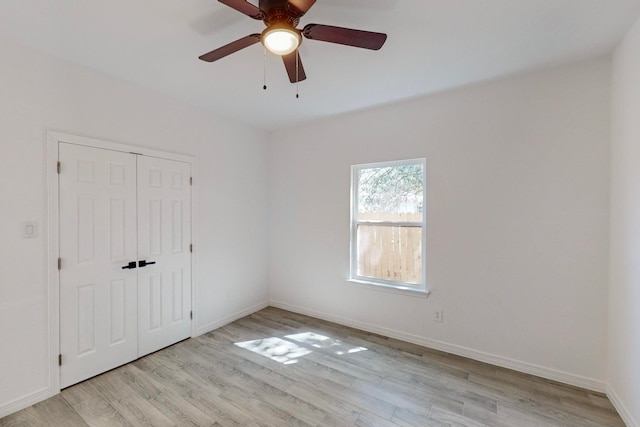 unfurnished room with ceiling fan and light hardwood / wood-style floors