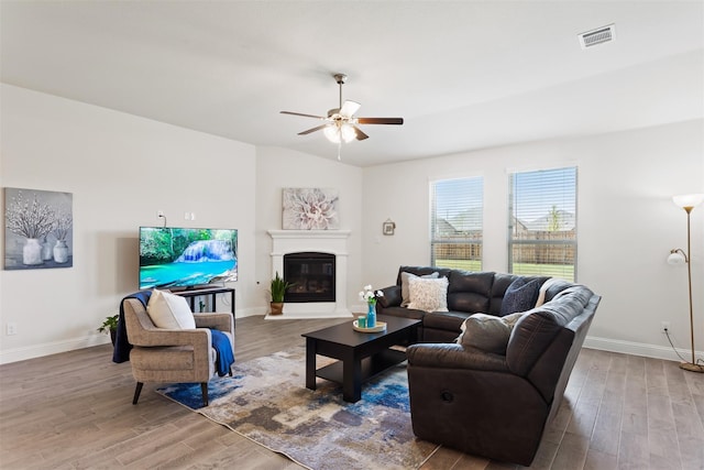 living room with ceiling fan and hardwood / wood-style floors