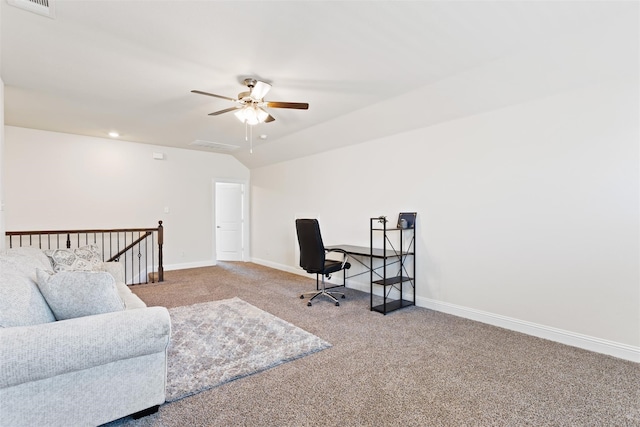 carpeted home office featuring lofted ceiling and ceiling fan