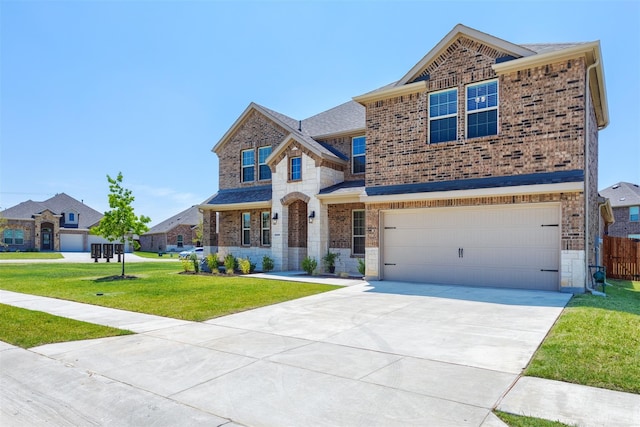 view of front of home featuring a garage and a front yard