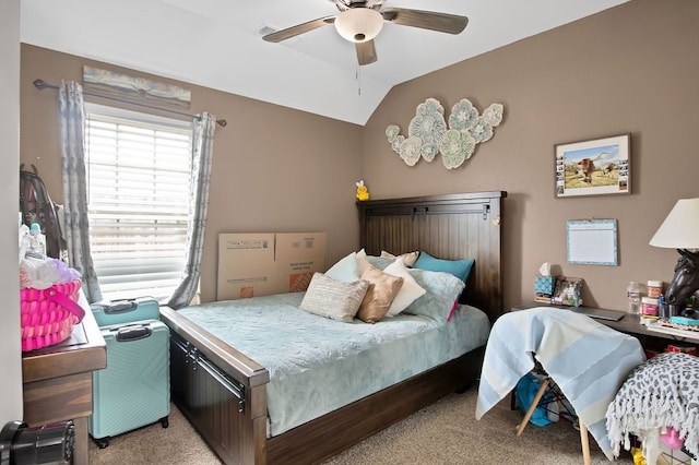 bedroom featuring lofted ceiling, ceiling fan, and light carpet