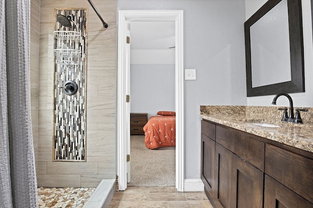 bathroom featuring a shower with shower curtain and vanity