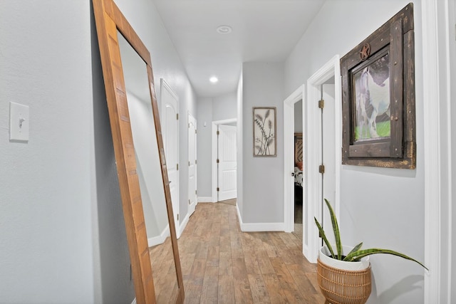 corridor with light wood-type flooring