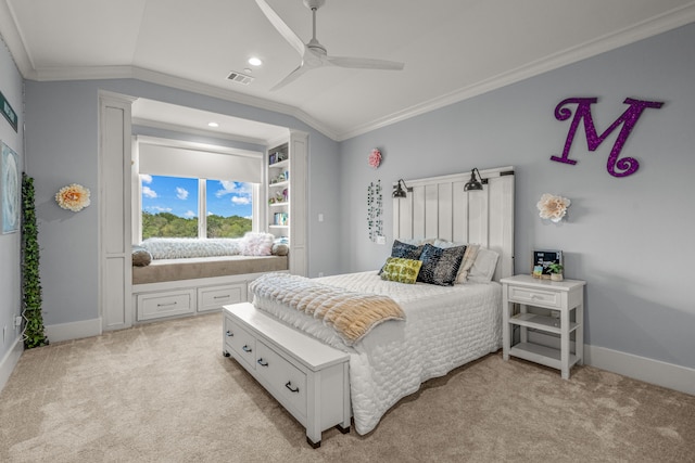 carpeted bedroom with lofted ceiling, ceiling fan, and ornamental molding