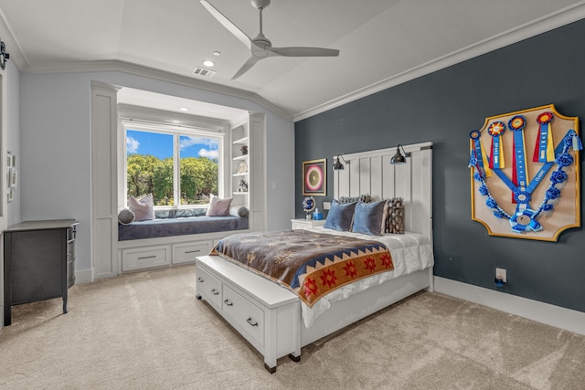 bedroom with ornamental molding, lofted ceiling, light colored carpet, and ceiling fan