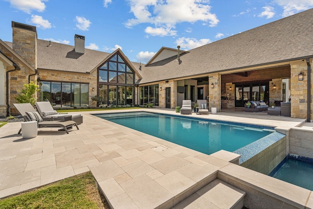 view of swimming pool with an outdoor hangout area and a patio