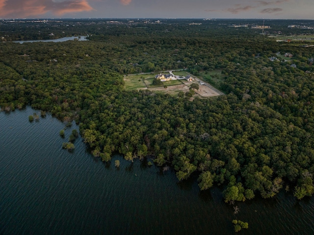 aerial view at dusk with a water view