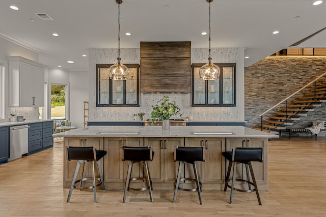 kitchen with stainless steel dishwasher, an inviting chandelier, a large island, and white cabinetry