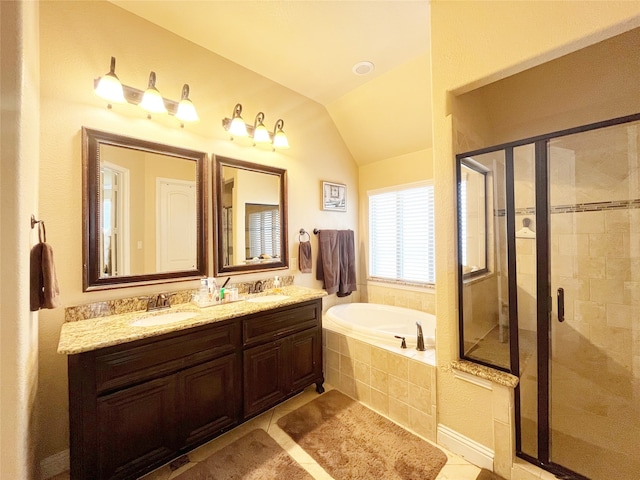 bathroom featuring vanity, lofted ceiling, separate shower and tub, and tile patterned floors