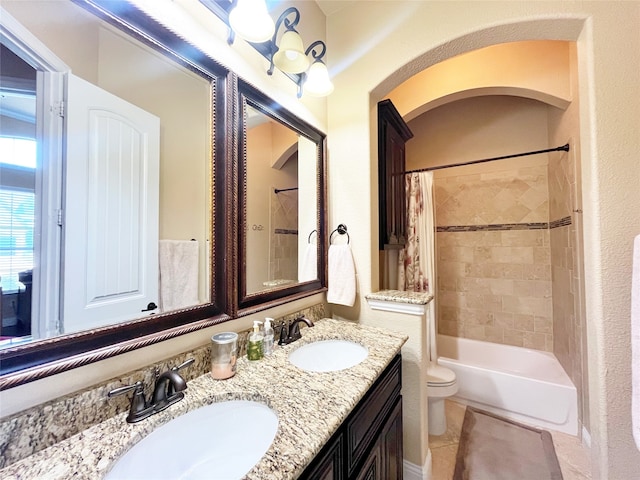 full bathroom featuring vanity, toilet, tile patterned flooring, and shower / bath combo