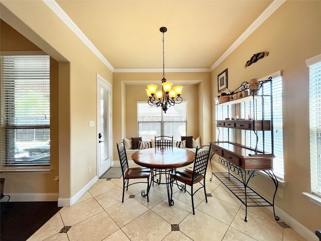 tiled dining room with a notable chandelier and ornamental molding