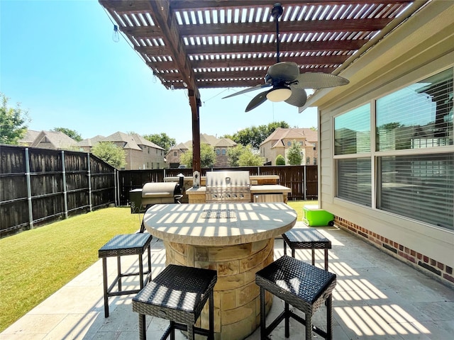 view of patio with grilling area, a pergola, exterior kitchen, ceiling fan, and an outdoor bar