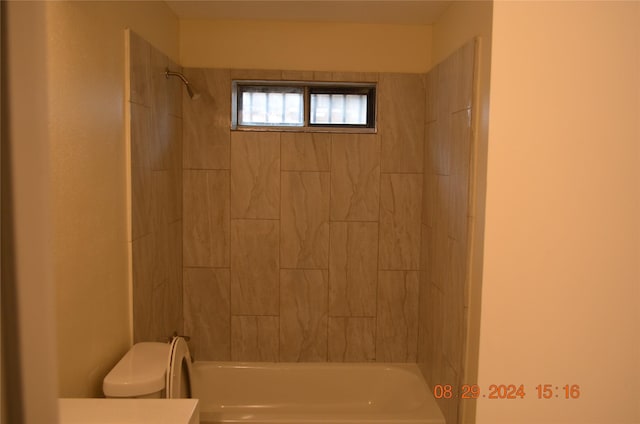 bathroom with vanity, toilet, and shower / bathtub combination