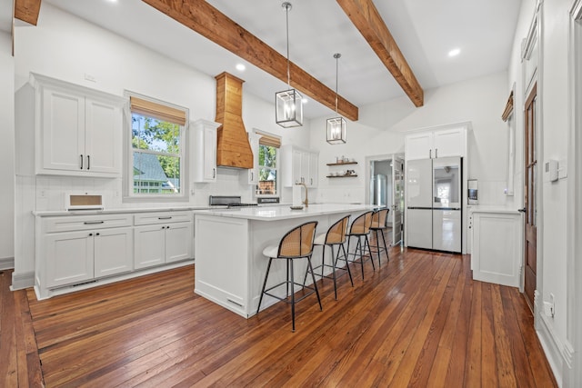 kitchen featuring decorative backsplash, stainless steel appliances, and white cabinetry