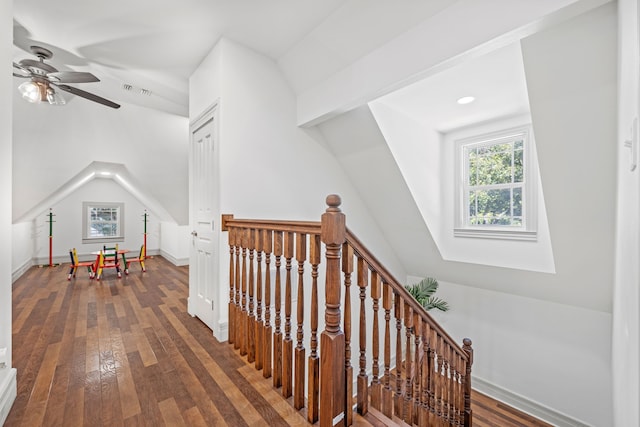 interior space with hardwood / wood-style flooring and lofted ceiling with skylight