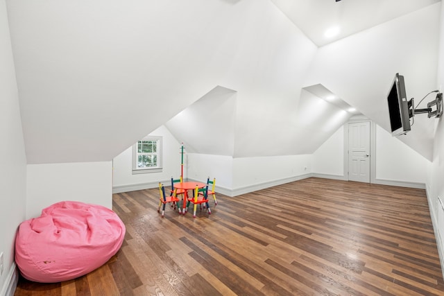 game room with vaulted ceiling and hardwood / wood-style flooring