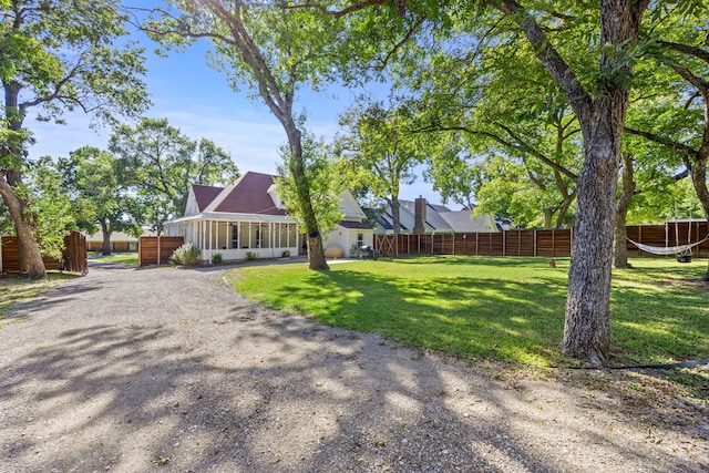 exterior space featuring a sunroom