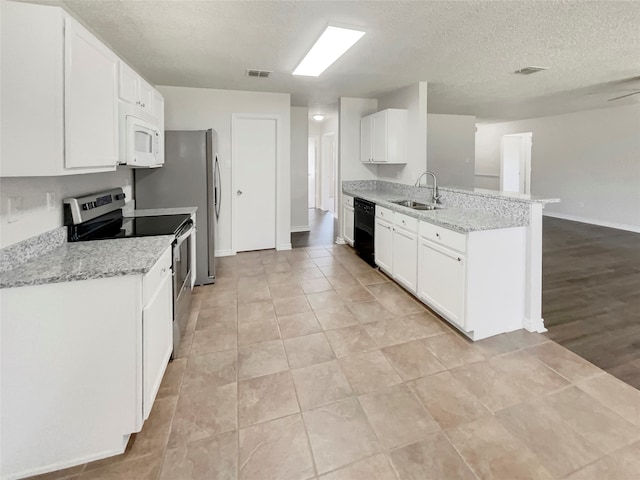 kitchen with stainless steel electric range, dishwasher, light stone counters, kitchen peninsula, and light hardwood / wood-style floors