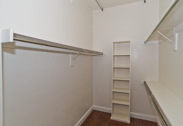 bathroom featuring vanity, lofted ceiling, wood-type flooring, and plus walk in shower