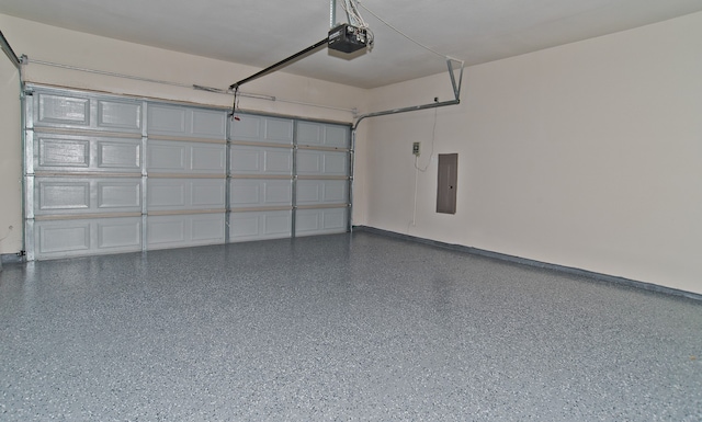 garage featuring a garage door opener and electric panel