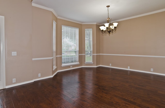 spare room with a notable chandelier, dark hardwood / wood-style flooring, and crown molding