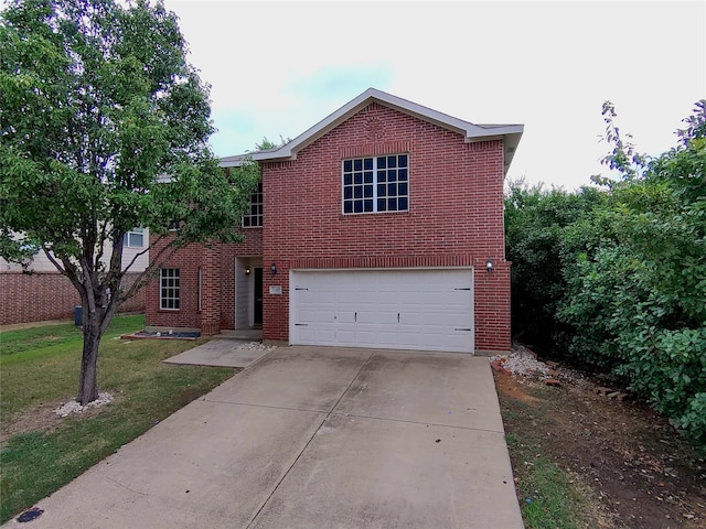 view of front of home with a garage and a front yard