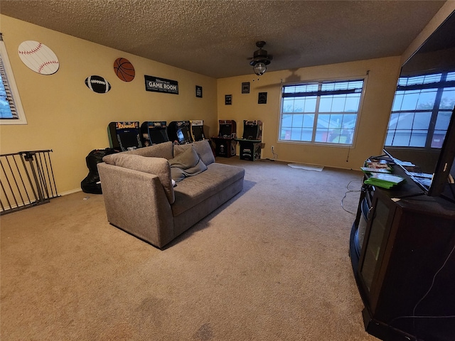 carpeted living room featuring a textured ceiling and ceiling fan